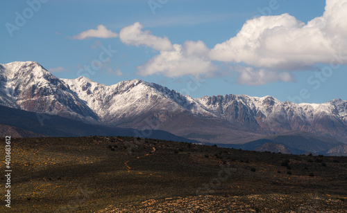 Desert valley and snowy mountains landscape in Southern Utah