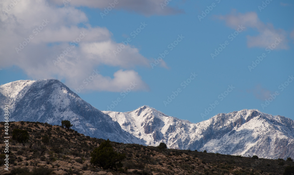 Snowy mountains above the dry desert wilderness, Southern Utah