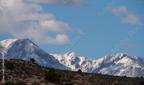 Snowy mountains above the dry desert wilderness, Southern Utah © Austin Broadbent