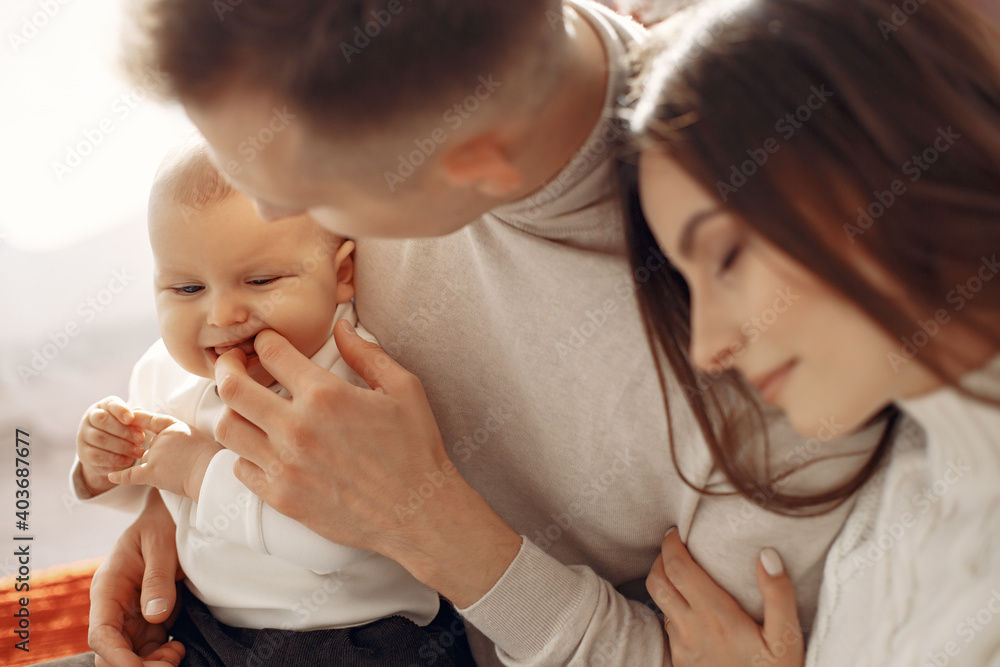 People preparing for Christmas. People sitting on a bed. Family is resting in a festive room. People preparing for Christmas. People sitting on a bed. Family is resting in a festive room.
