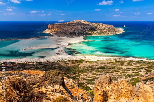 Fototapeta Naklejka Na Ścianę i Meble -  Amazing beach with turquoise water at Balos Lagoon and Gramvousa in Crete, Greece. Cap tigani in the center. Balos beach on Crete island, Greece. Landscape of Balos beach at Crete island in Greece.