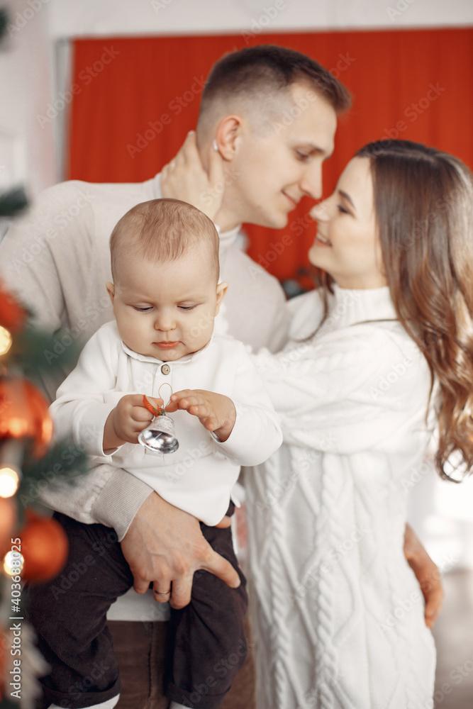 People preparing for Christmas. People by the Christmas tree. Family is resting in a festive room. People preparing for Christmas. People by the Christmas tree. Family is resting in a festive room.