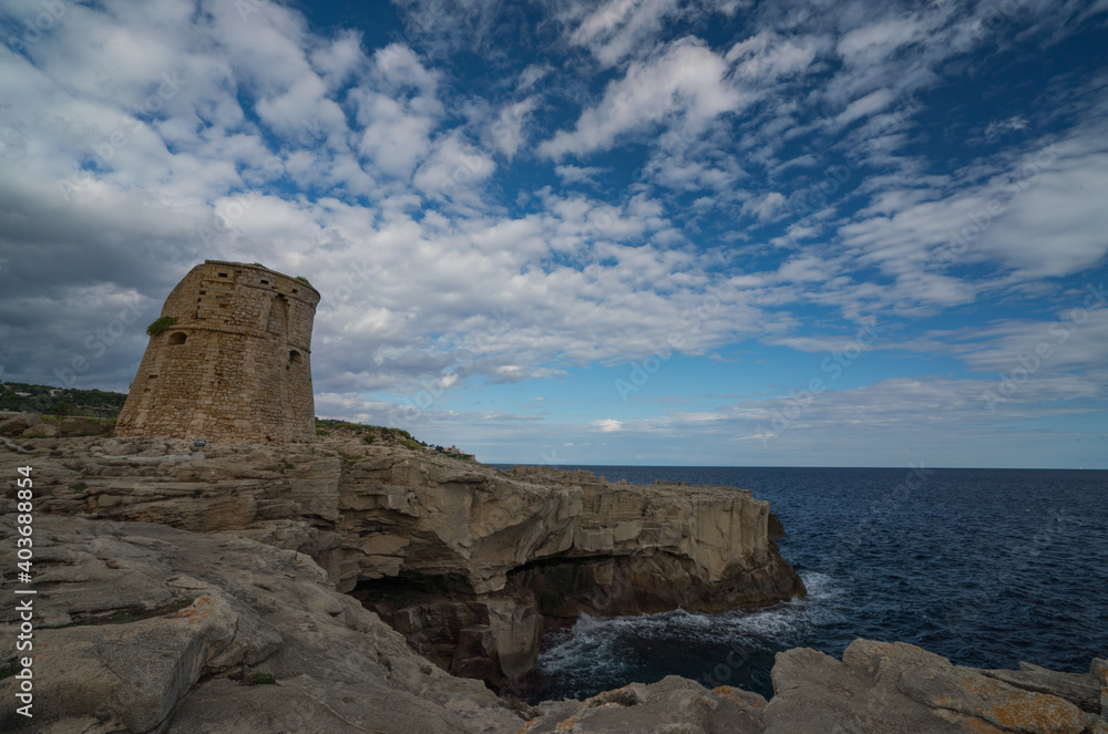 Rocky coast with a historic tower Puglia Italy