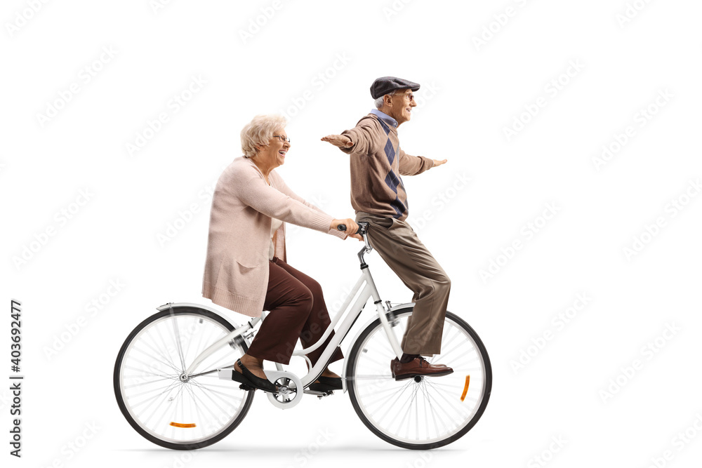 Elderly couple riding on a bicycle Elderly couple riding on a bicycle