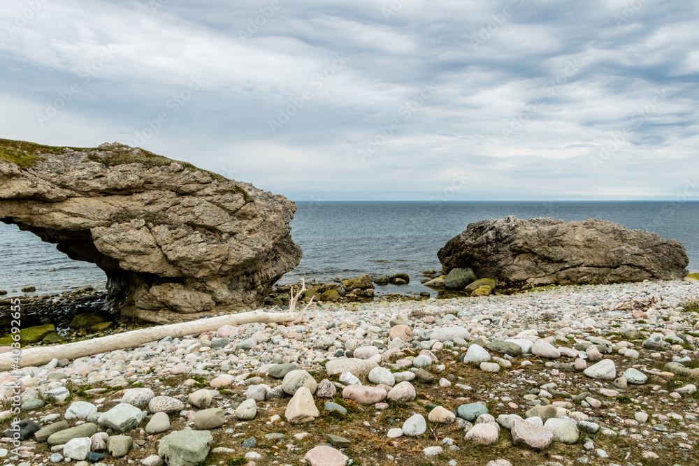 Sea stacks and caves at low tide. Arches Provincial Park, Newfoundland, Canada Sea stacks and caves at low tide. Arches Provincial Park, Newfoundland, Canada