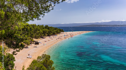 Fototapeta Naklejka Na Ścianę i Meble -  Zlatni Rat (Golden Cape or Golden Horn) famous turquoise beach in Bol town on Brac island, Dalmatia, Croatia. Zlatni Rat sandy beach at Bol on Brac island of Croatia in summertime.