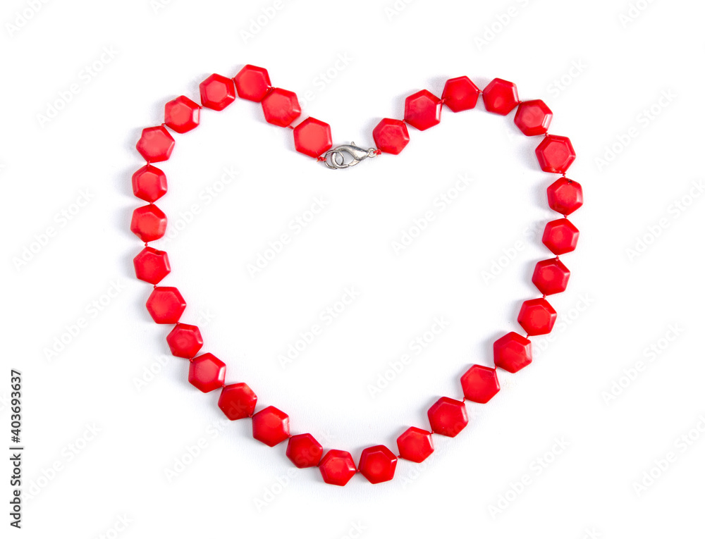 Beads with red stones a heart shaped on white background, Valentine's Day Beads with red stones a heart shaped on white background, Valentine's Day