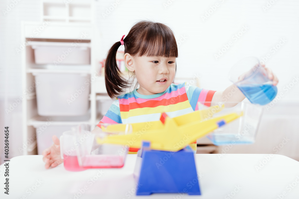 young girl play balance toy for homeschooling young girl play balance toy for homeschooling