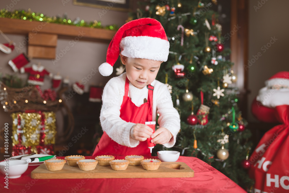 young girl preparing mince pie for celebrating Christmas party young girl preparing mince pie for celebrating Christmas party