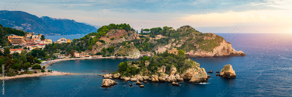 Aerial view of Isola Bella in Taormina, Sicily, Italy. Isola Bella is small island near Taormina, Sicily, Italy. Narrow path connects island to mainland Taormina beach in azure waters of Ionian Sea.