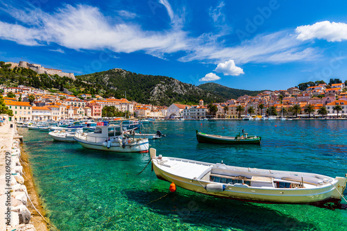 View at amazing archipelago with boats in front of town Hvar  Croatia. Harbor of old Adriatic island town Hvar. Popular touristic destination of Croatia. Amazing Hvar city on Hvar island  Croatia.