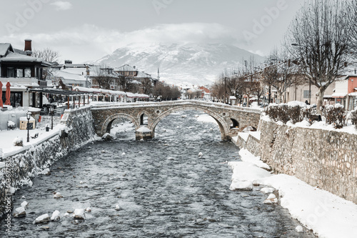 Arch bridge and Bistrica river at the old city of Prizren, Kosovo in winter season at morning