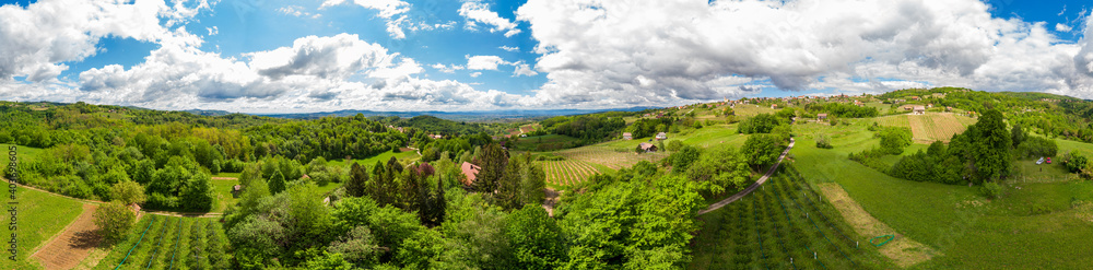 Picturesque aerial panorama of spring countryside on a sunny day.