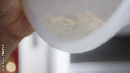 Pouring flour into a bowl