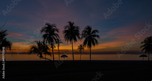 Sunset over the beach and palm trees El Colony  ex Hilton  Isla de Juventud Cuba