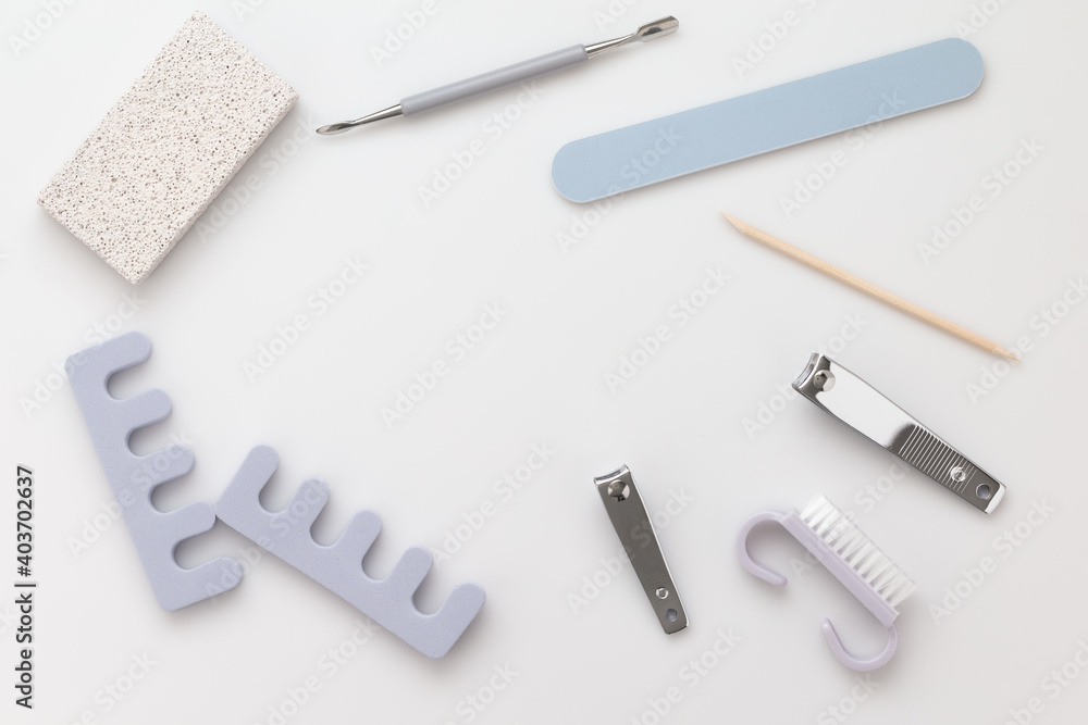 a set of cosmetic tools for manicure and pedicure on a white background. a set of cosmetic tools for manicure and pedicure on a white background.