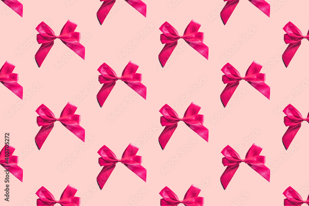 Pink bows pattern on pink background. Gift wrapping