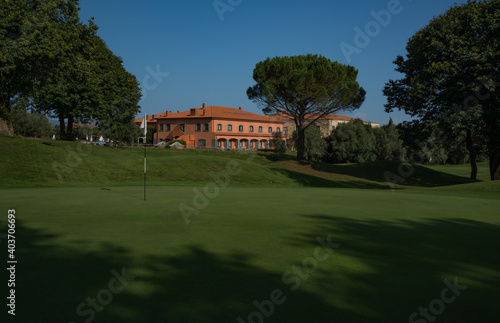 Il Picciolo golf course green nr. 18 and clubhouse Sicily Italy