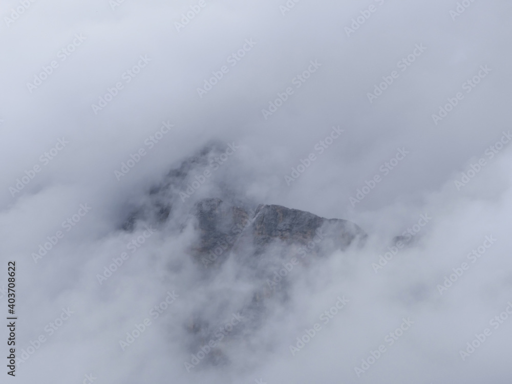 Wetterstein Mountains, Zugspitz Region In Tyrol, A Small Part Of Rock Faces Surrounded By Clouds