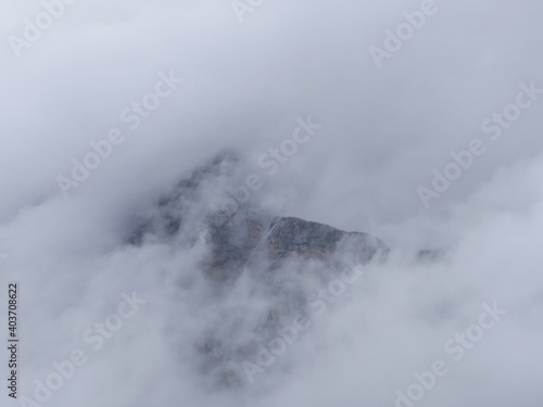 Wetterstein Mountains  Zugspitz Region In Tyrol  A Small Part Of Rock Faces Surrounded By Clouds