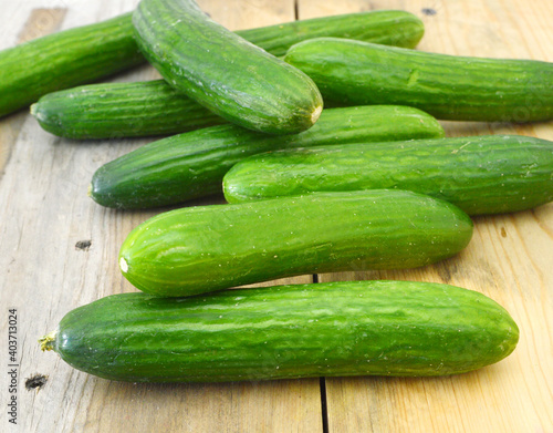 fresh cucumbers isolated on wooden board