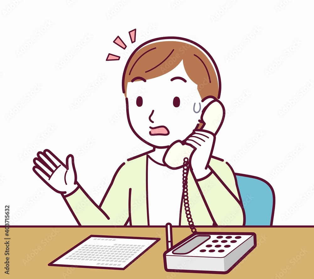 Young woman in a cardigan_Fixed-line phone Young woman in a cardigan_Fixed-line phone