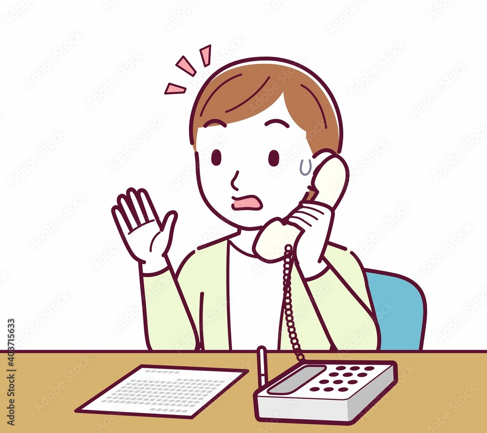 Young woman in a cardigan_Fixed-line phone Young woman in a cardigan_Fixed-line phone
