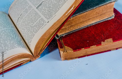 old books deteriorated by time with white background