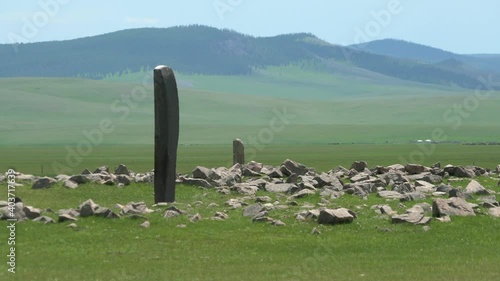Inscription of obelisk menhir from old ancient times.Deer stone is megalith carved with symbols.Deerstone cemeteries orthostat stele steppe history historical antique petroglyph monuments memorial 4K