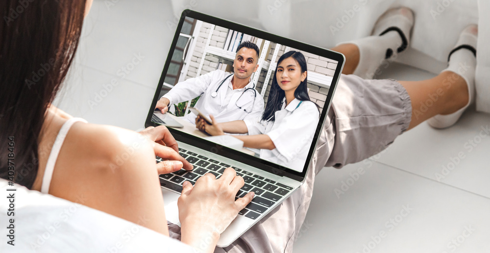 Woman talk speak using laptop computer and video conference online with doctor and stethoscope service help support team discussing and consulting talk video chat call checkup information at home Woman talk speak using laptop computer and video conference online with doctor and stethoscope service help support team discussing and consulting talk video chat call checkup information at home