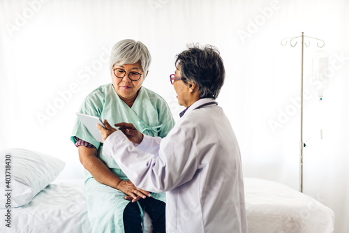 Doctor consulting and check up information with senior woman in hospital.elderly woman has sick.healthcare and medicine