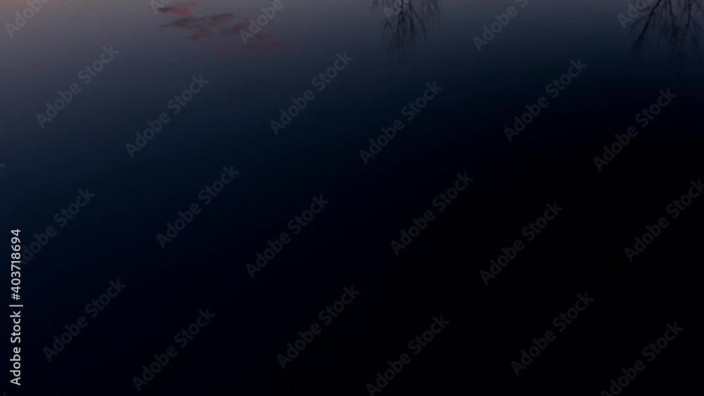 Autumn landscape reflects on the roof of a car. Sunset colors. Slow tilt up view. Autumn landscape reflects on the roof of a car. Sunset colors. Slow tilt up view.