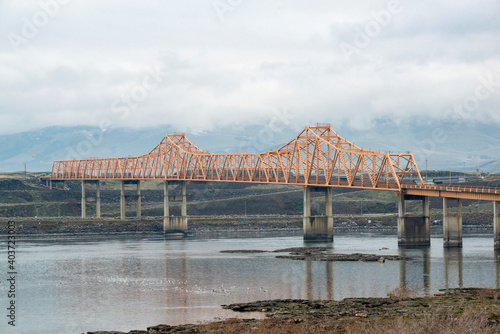 The Dalles Bridge along U.S. Route 197 (US 197) spans the Columbia River in the United States between The Dalles, Oregon and Dallesport, Washington photo