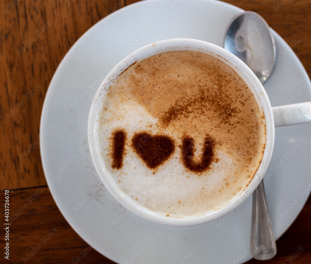 Top view of a cup of hot coffee cappuccino, latte decorated with heart art I love you message. Top view of a cup of hot coffee cappuccino, latte decorated with heart art I love you message.