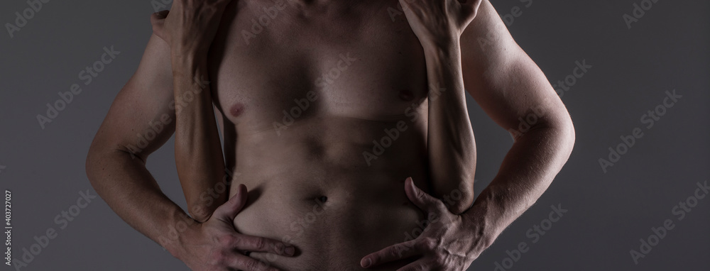 Naklejka premium Sexy couple. Sensual strong man and woman. Sexy photo. Erotica. Background. 