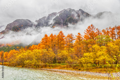 Kamikochi National Park in the Northern Japan Alps of Nagano Prefecture, Japan. Beautiful mountain in autumn leaf with river.