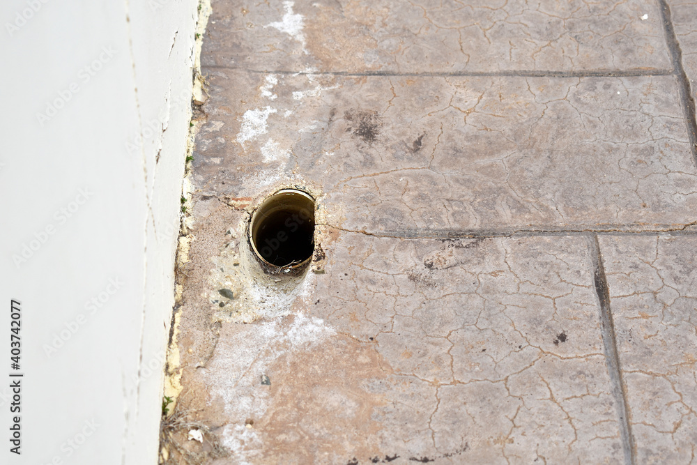 Drain hole on the footpath or pavement. Drain hole on the footpath or pavement.