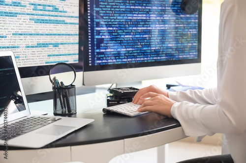 Female programmer working i...