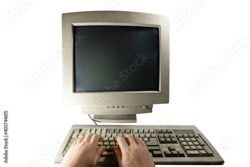 A man using an old personal computer . Ancient concept . On a white background isolated