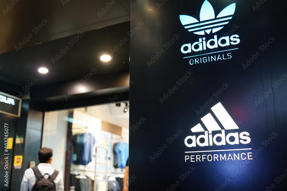 Adidas retail store sign in Ximending shopping district, Taiwan. Adidas is  a German corporation that designs footwear and clothing. TAIPEI, TAIWAN -  JUNE 25, 2018. Stock Photo | Adobe Stock