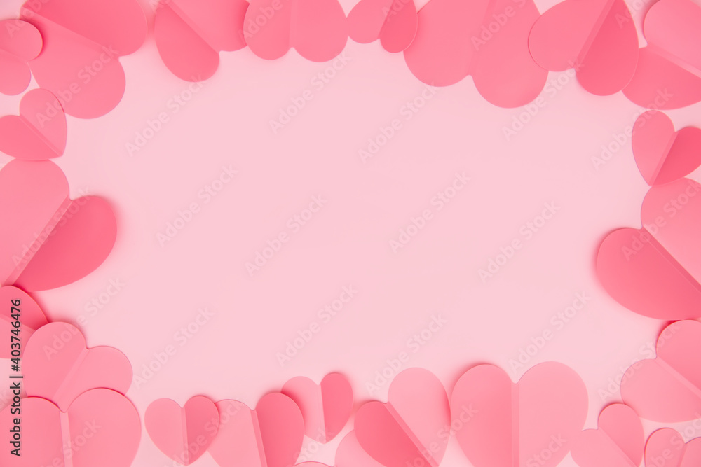 Pink paper craft hearts frame. Valentines or Wedding romance frame made with paper cut hearts. 