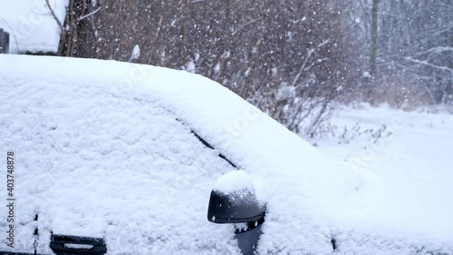 Wallpaper Mural Snow-covered black car under the snow on the background of trees. Torontodigital.ca