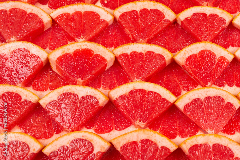 Grapefruit red juicy slices background. top view. Grapefruit red juicy slices background. top view.