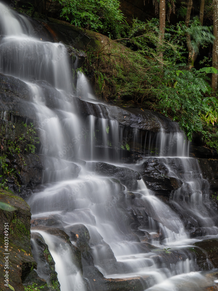 Obraz premium Close-up side view of rocky waterfall.