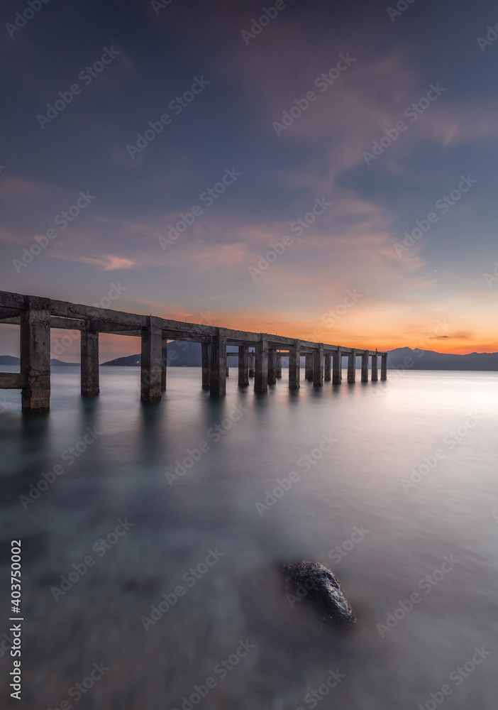 The bridge near the beach at dusk