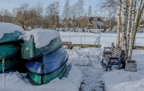 A boat station closed until spring on the banks of the Izhora River in Kolpino, St. Petersburg photo