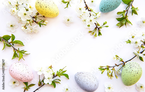 Photography Colorful Easter eggs with spring blossom flowers