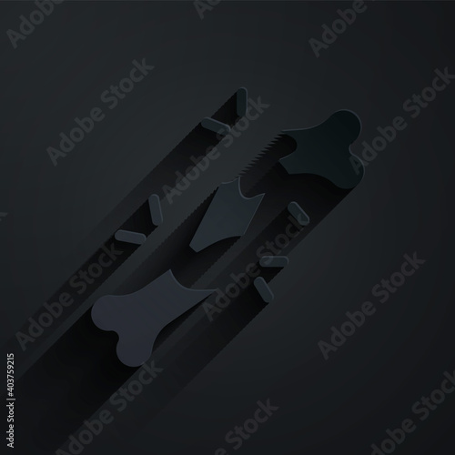 Paper cut Human broken bone icon isolated on black background. Paper art style. Vector.