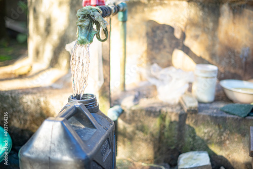 Dirty Water Coming out of Faucet For Poor Cummunity to drink photo