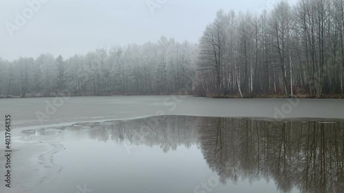 winter landscape on a lake with hoarfrost in poland photo